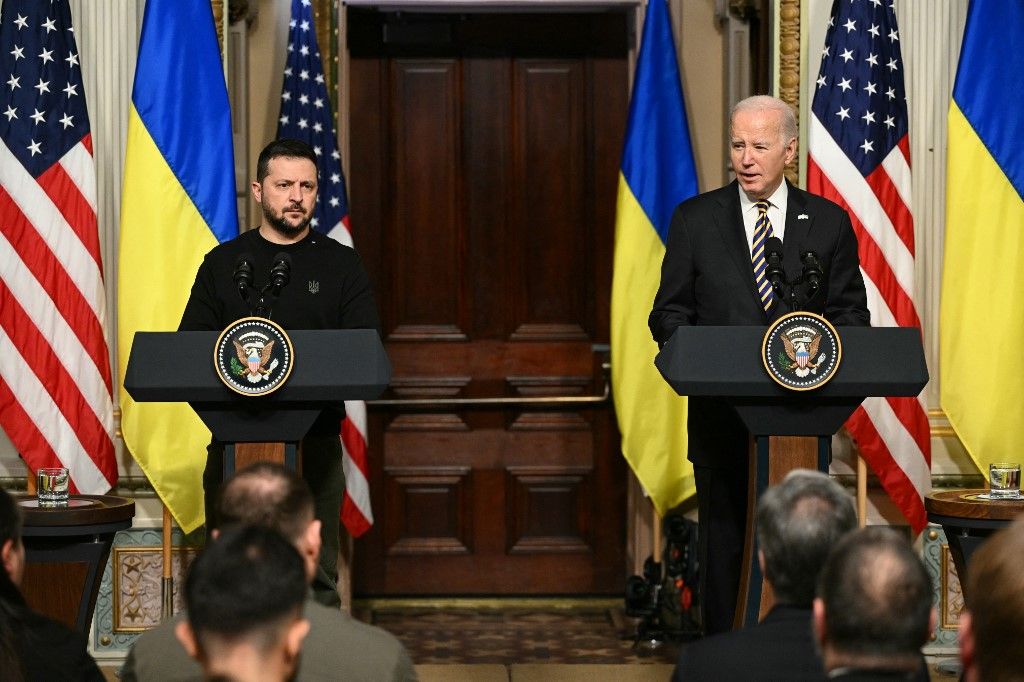 US President Joe Biden and Ukraine’s President Volodymyr Zelensky hold a joint press conference in the Indian Treaty Room of the Eisenhower Executive Office Building, next to the White House, in Washington, DC, on December 12, 2023. (Photo by Mandel NGAN / AFP)