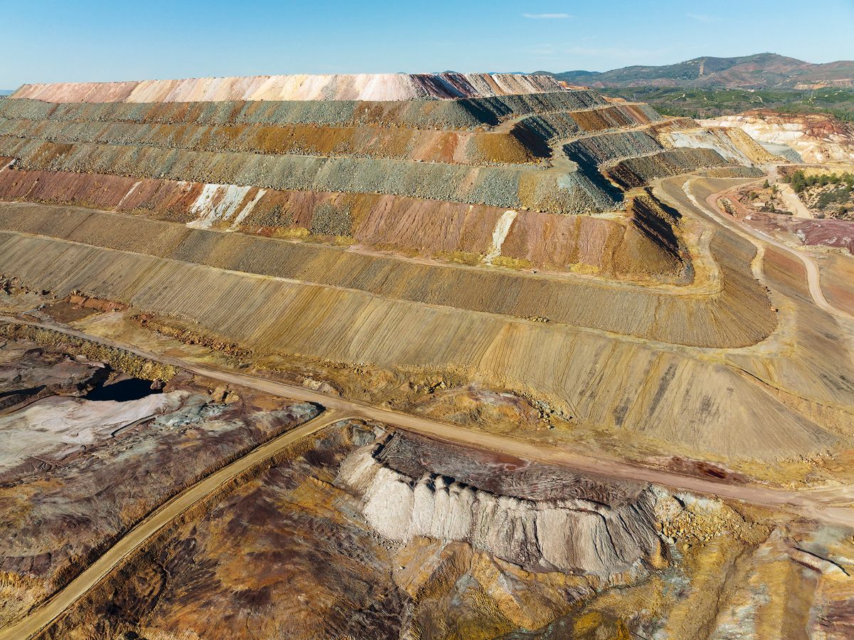 Mining waste dump and extremely mineral-rich ground and rock, scarred by the open-cast mineworkings of the Rio Tinto mines at the town of Minas de Riotinto. Aerial view. Drone shot. Huelva province, Andalusia, Spain. Mining waste dump and extremely mineral-rich ground and rock, scarred by the open-cast mineworkings of the Rio Tinto mines at the town of Minas de Riotinto. Aerial view. Drone shot. Huelva province, Andalusia, Spain. (Photo by Thomas Dressler / Biosphoto / Biosphoto via AFP)