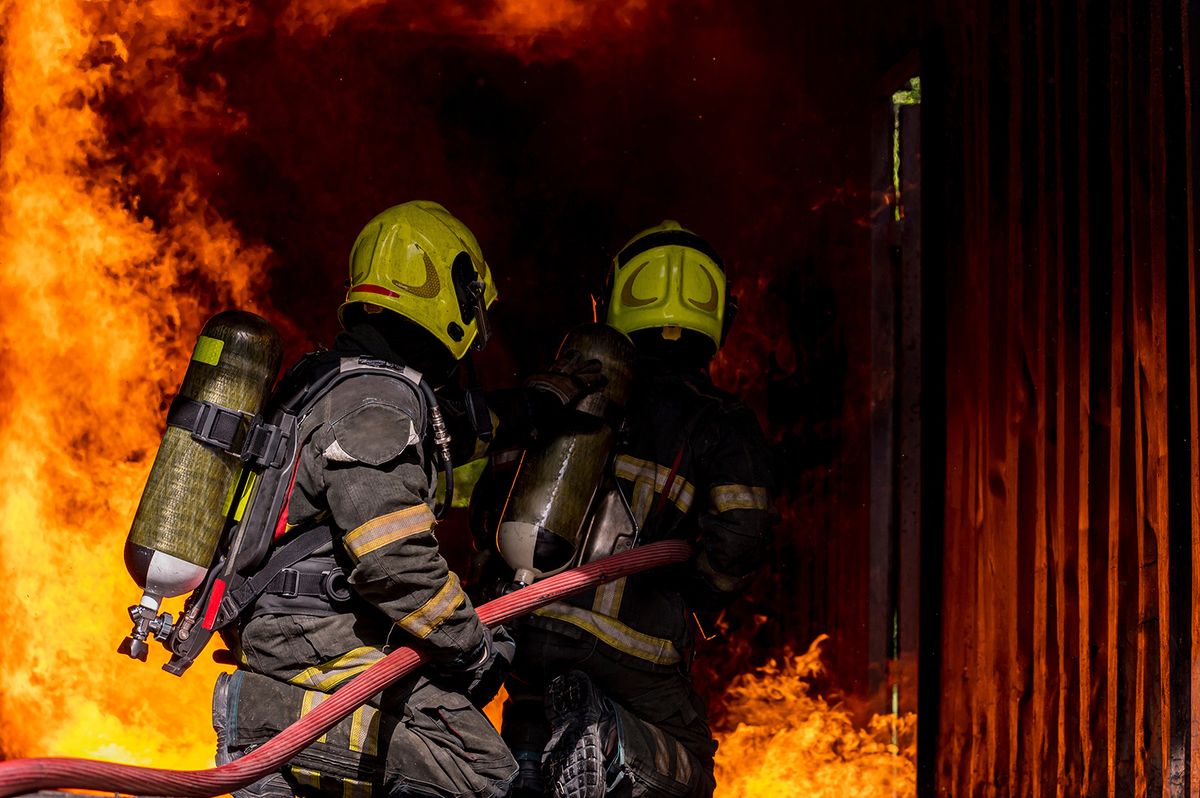 Firefighters,Wearing,Fire,Fighter,Suit,For,Safety,And,Using,Twirl