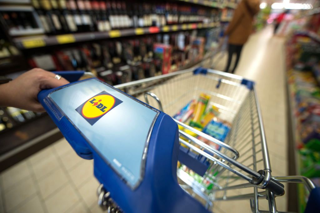 Supermarket discounter Lidl
A customer pushes her shopping cart through the aisle of a branch store of supermarket food discounter Lidl in Stuttgart, Germany, 3 March 2015. Photo: Marijan Murat/dpa | usage worldwide   (Photo by Marijan Murat/picture alliance via Getty Images)