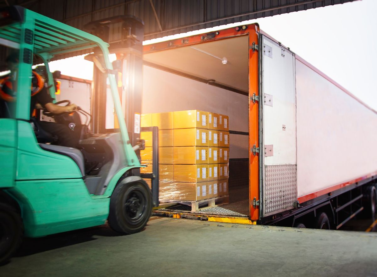 Forklift,Tractor,Loading,Package,Boxes,On,Pallet,Into,Cargo,Container.
Forklift Tractor Loading Package Boxes on Pallet into Cargo Container. TrailerTruck Parked Loading at Dock Warehouse. Shipment Delivery. Supply Chain. Shipping Logistics Freight Truck Transportation.