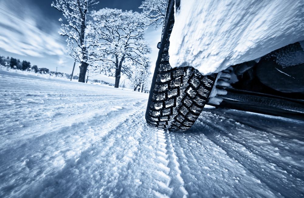 Car,Tires,On,Winter,Road