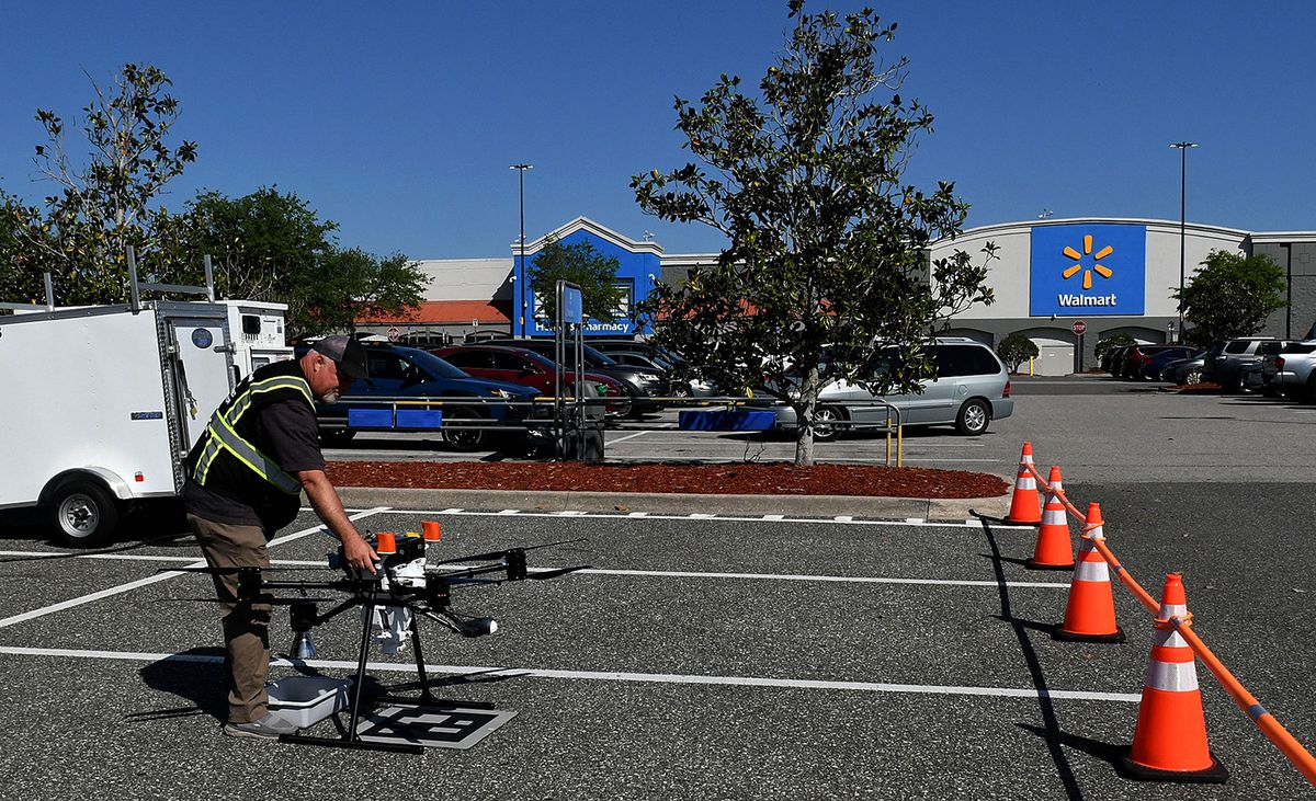 CLERMONT, FLORIDA, UNITED STATES - MARCH 30: Flight engineer Brian Scoles performs a pre-flight inspection of a delivery drone at the DroneUp hub in the parking lot at the Walmart Supercenter in Clermont, Florida, United States on March 30, 2023. Walmart customers who live within one mile of the store can have certain items weighing up to 10 pounds delivered to their home by drone within 30 minutes for a $3.99 fee. Paul Hennesy / Anadolu Agency (Photo by Paul Hennesy / ANADOLU AGENCY / Anadolu via AFP)