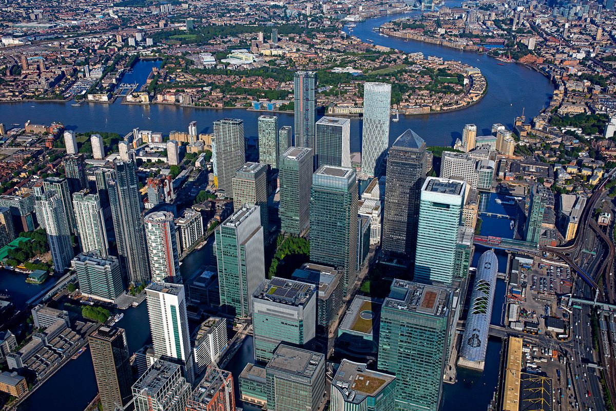 UK, London, Canary Wharf, Aerial view of skyscrapers in business district (Photo by Paul Campbell / Image Source / Image Source via AFP)