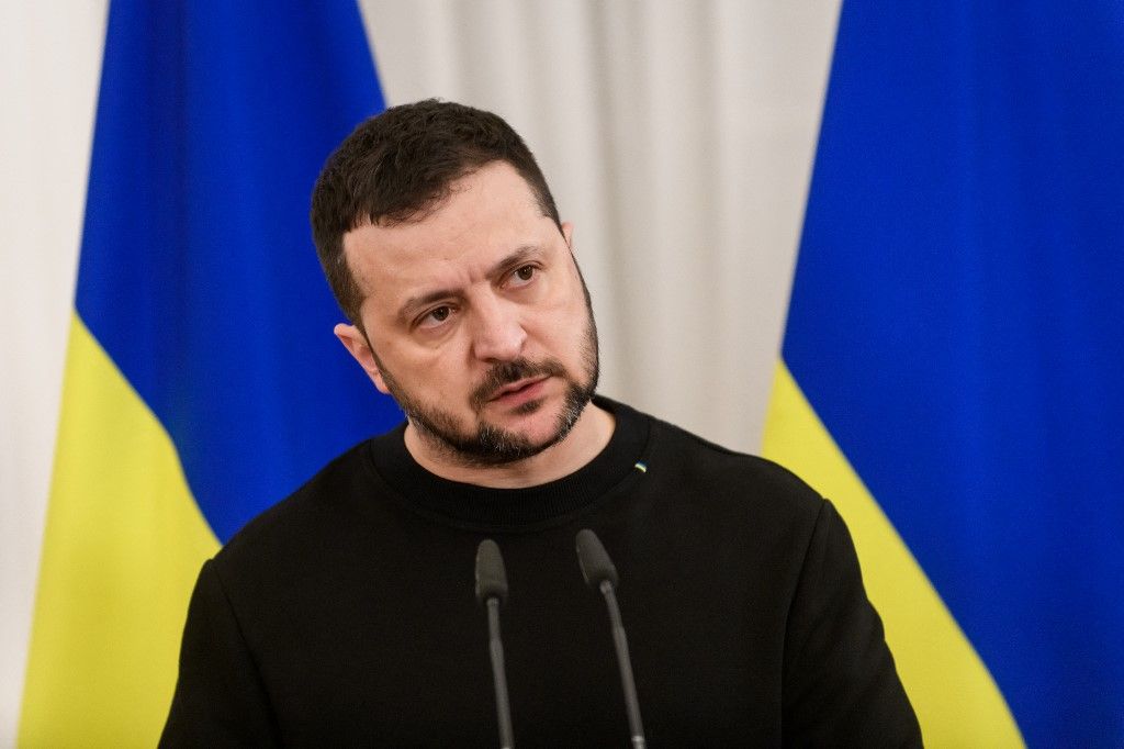 Ukraine's President Volodymyr Zelensky speaks and gestures during a joint press conference after talks with Latvia's President on January 11, 2024 in Riga, Latvia. (Photo by Gints Ivuskans / AFP)