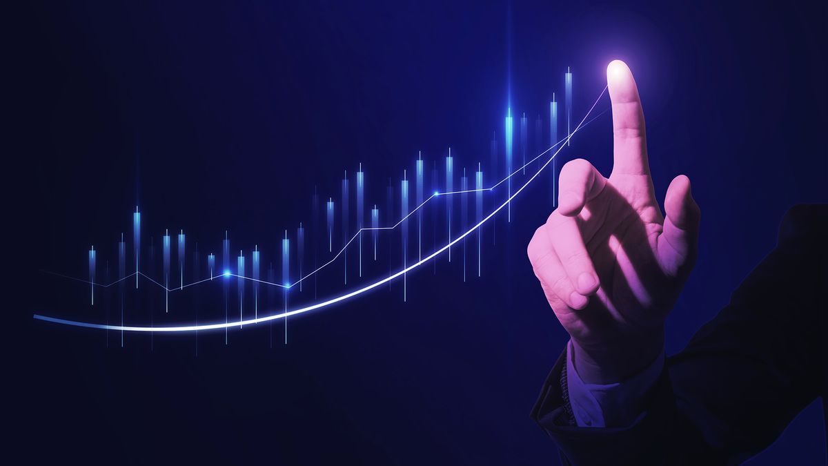 Close,Up,Of,Hand,Pointing,At,Glowing,Business,Chart,On