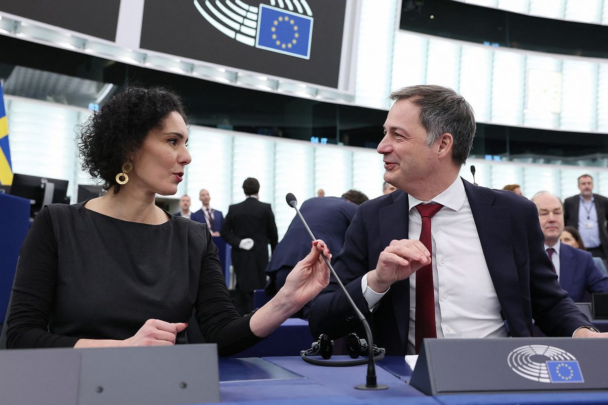 Belgium Foreign Minister Hadja Lahbib (L) and Belgian Prime Minister Alexander De Croo (R) react upon their arrival to attend a debate focused on priorities of Belgium’s Council Presidency during a plenary session at the European Parliament in Strasbourg, eastern France on January 16, 2024. (Photo by FREDERICK FLORIN / AFP)