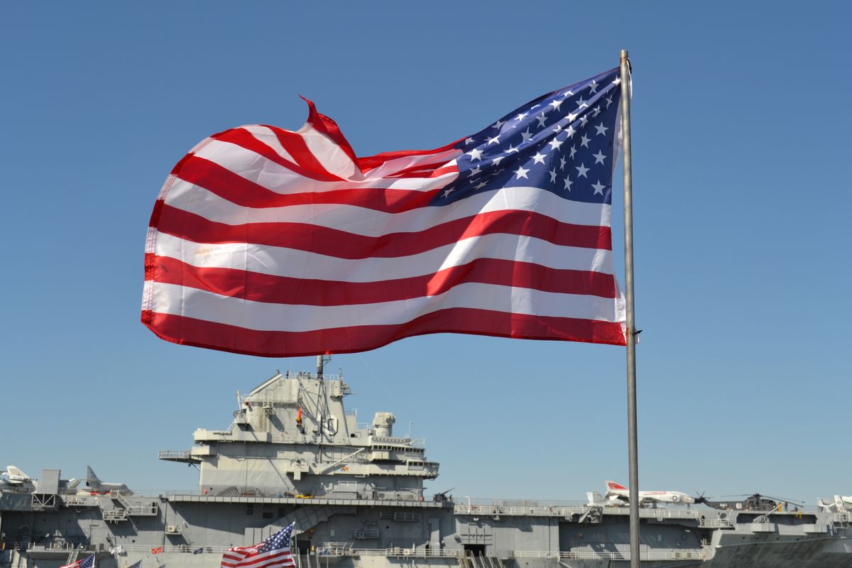 Stars and Stripes in front of USS YorktownStars and Stripes in front of USS Yorktown Aircraft Carrier