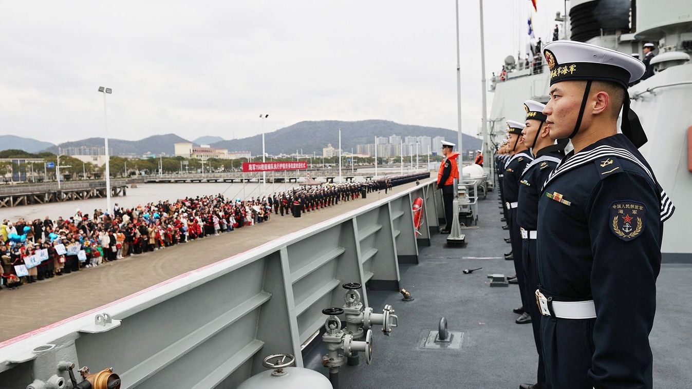 (231218) -- HANGZHOU, Dec. 18, 2023 (Xinhua) -- Soldiers line up on the deck in Zhoushan, east China's Zhejiang Province, Dec. 18, 2023. A Chinese navy fleet returned to the port city of Zhoushan in Zhejiang Province, east China, on Monday after completing escort missions.   The 44th fleet of the Chinese People's Liberation Army Navy, comprising the guided-missile destroyer Zibo, the guided-missile frigate Jingzhou, and the comprehensive supply ship Qiandaohu, escorted 33 Chinese and foreign ships during the missions in areas including the Gulf of Aden, the waters off Somalia and the Arabian Sea.TO GO WITH "Chinese navy fleet returns from escort missions" (Photo by Fang Sihang/Xinhua) (Photo by Fang Sihang / XINHUA / Xinhua via AFP)