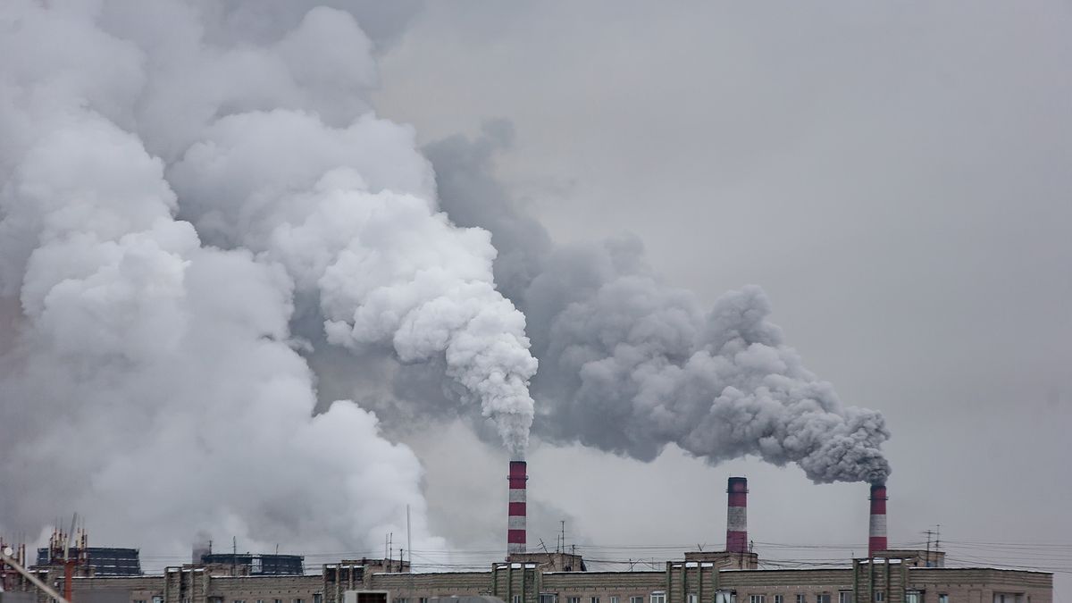 Industrial,Chimneys,With,Heavy,Smoke,Causing,Air,Pollution,On,The,carbon,