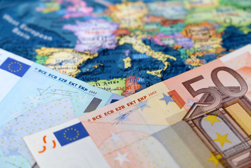 Euro,Banknotes,On,The,Europe,Map.,Concept,Of,Eurozone,,European
