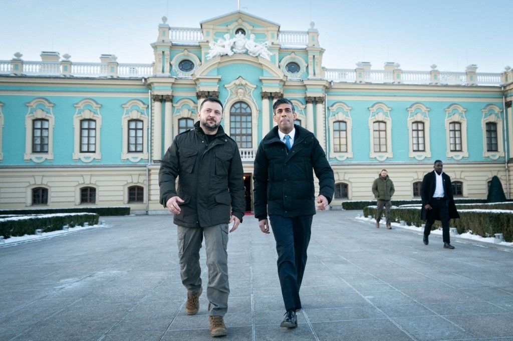 Ukrainian President Volodymyr Zelensky walks with Britain's Prime Minister Rishi Sunak (R) during a visit to the Presidential Palace in Kyiv on January 12, 2024. Sunak visited Kyiv to launch "a major new package of support" for Ukraine and increase military funding for this financial year to £2.5 billion ($3.2 billion), his office said. (Photo by Stefan Rousseau / POOL / AFP)