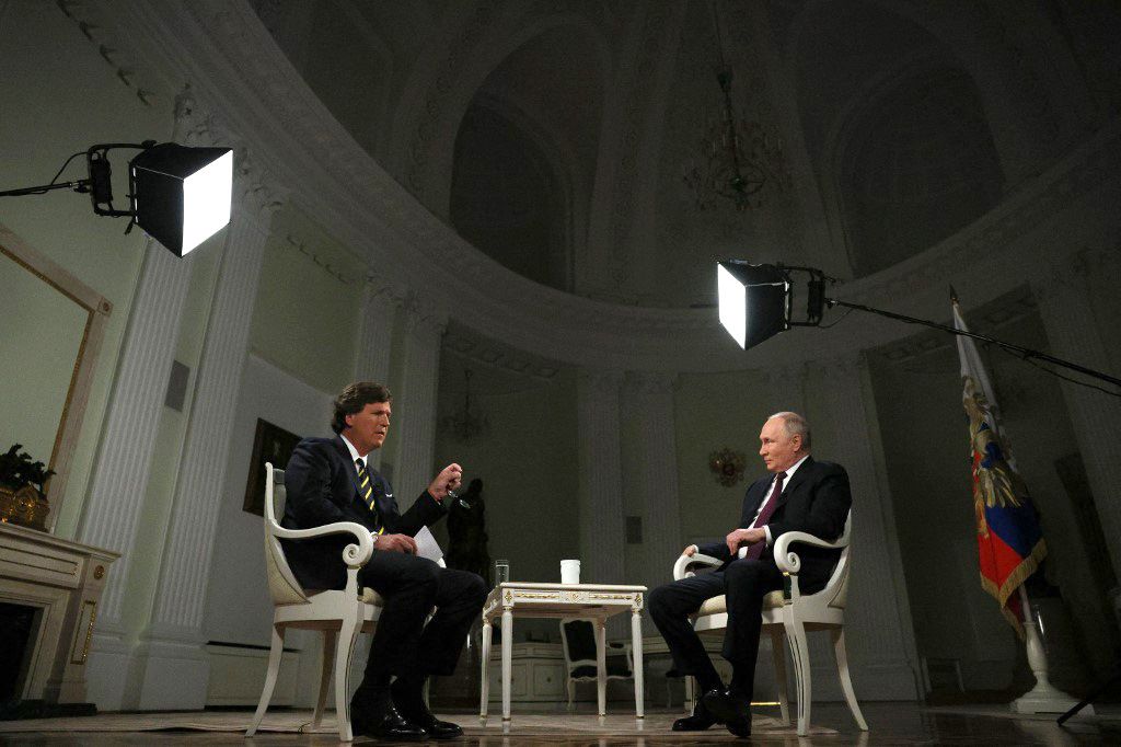 RUSSIA-US-POLITICS-PUTIN-INTERVIEWIn this pool photograph distributed by Russian state agency Sputnik, Russia's President Vladimir Putin gives an interview to US talk show host Tucker Carlson at the Kremlin in Moscow on February 6, 2024. (Photo by Gavriil GRIGOROV / POOL / AFP)