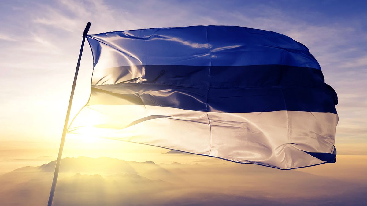 Estonia Estonian flag textile cloth fabric waving on the top sunrise mist fog
Észtország, észt