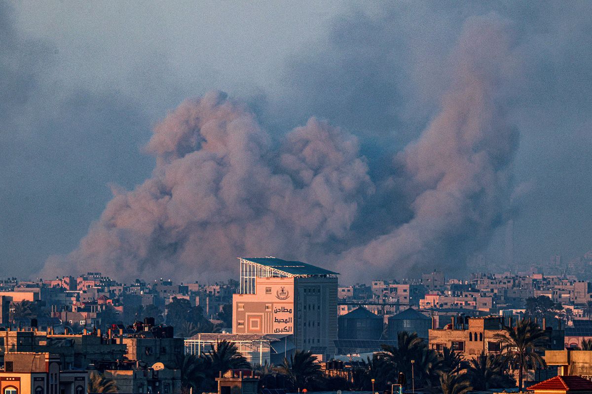 A picture taken from Rafah shows smoke billowing during Israeli bombardment over Khan Yunis in the southern Gaza Strip on February 10, 2024, amid the ongoing conflict between Israel and the Palestinian Hamas militant group. (Photo by SAID KHATIB / AFP)