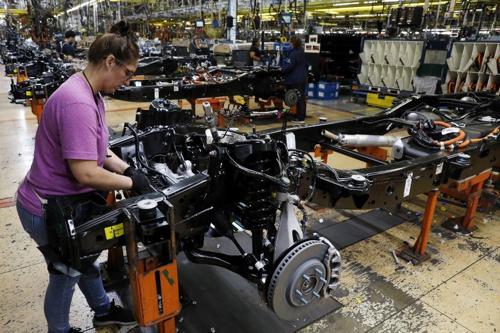 Ford's EV drive reboots historic Michigan factory once againWorkers put engines on the frame as Ford Motor Co. fuel powered F-150 trucks under production at their Truck Plant in Dearborn, Michigan on September 20, 2022. Construction crews are back at Dearborn, remaking Ford's century-old industrial complex once again, this time for a post-petroleum era that is finally beginning to feel possible.
The manufacturing operation's prime mission in recent times has been to assemble the best-selling F-150, a gasoline-powered vehicle (Photo by JEFF KOWALSKY / AFP)