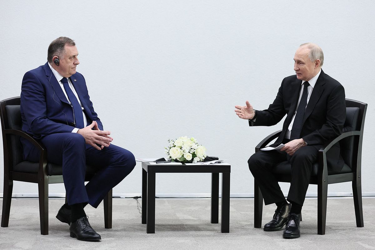 In this pool photograph distributed by Russian state agency Sputnik, Russia's President Vladimir Putin meets with President of the Republika Srpska, Milorad Dodik, in Kazan on February 21, 2024. (Photo by Sergei BOBYLYOV / POOL / AFP)