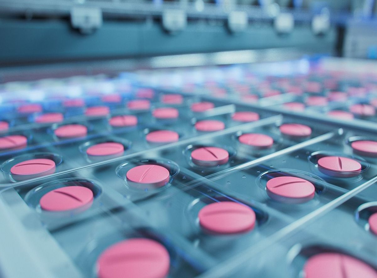 Macro,Shot,Of,Pink,Pills,During,Production,And,Packing,Process