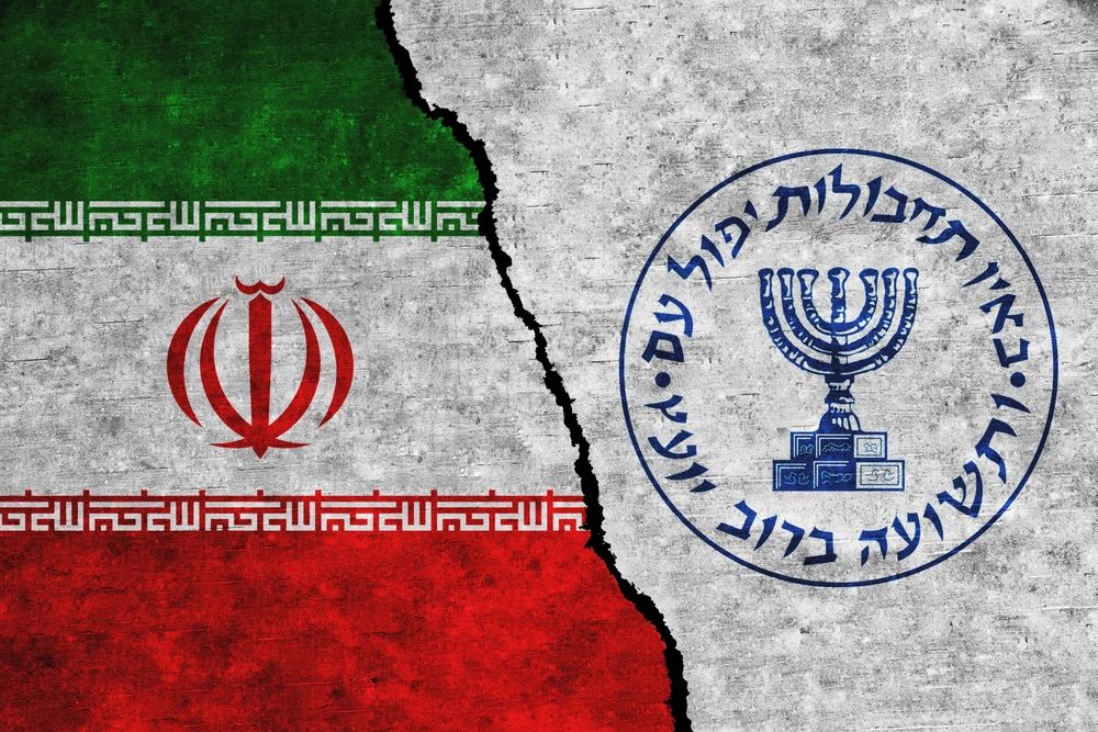 Iran,And,Mossad,Painted,Flags,On,A,Wall,With,A
Irán bejelentette, hogy olyan a Moszadhoz köthető kémeket tartóztatott le, akik korábban terrorakciókban vettek részt az országában. Az izraeli kémeket bíróság elé állítják.
