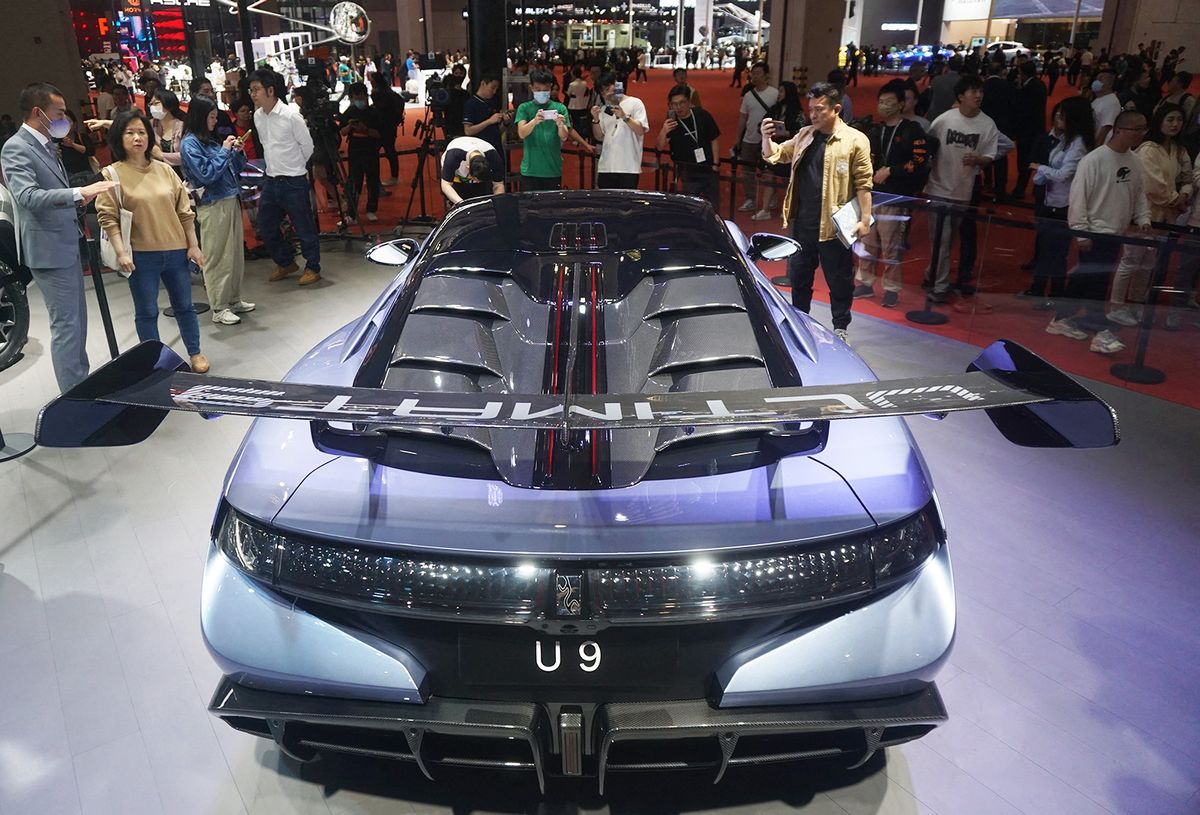 SHANGHAI, CHINA - APRIL 20, 2023 - Spectators look at BYD's first pure electric supercar ''Yangwang U9'' at the Shanghai Auto Show in Shanghai, China, April 19, 2023. Byd's pure electric supercar ''Yangwang U9'' is equipped with BYD's self-developed ''four-motor independent drive vehicle power architecture'' and Yunnian (New energy exclusive Intelligent body Control System) technology, which can accelerate 0-100km/h to 2 seconds. It is understood that ''Yangwang U9'' is positioned as a high-end new energy electric performance supercar, and the price may exceed one million yuan. (Photo by Costfoto/NurPhoto) (Photo by CFOTO / NurPhoto / NurPhoto via AFP)