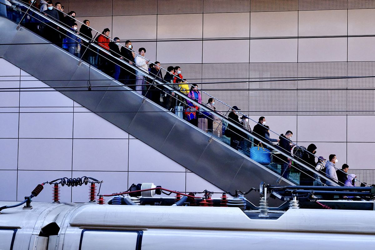 BEIJING, CHINA - JANUARY 26: People rush to the railway station as the railway Spring Festival travel running for 40 days begins in Beijing, China on January 26, 2024. The first high-speed train from Beijing will depart on 26th Jan. China Railway Beijing Bureau is expected to send 39.13 million passengers, an increase of 14.1% compared to 2019. The travel rush, usually a period of high transportation demand as people return home for family reunions, from Jan. 26 to March 5 this year, as the Spring Festival, China's biggest festival, will fall on 10th Feb. Li Yueran / Anadolu (Photo by Li Yueran / ANADOLU / Anadolu via AFP)l