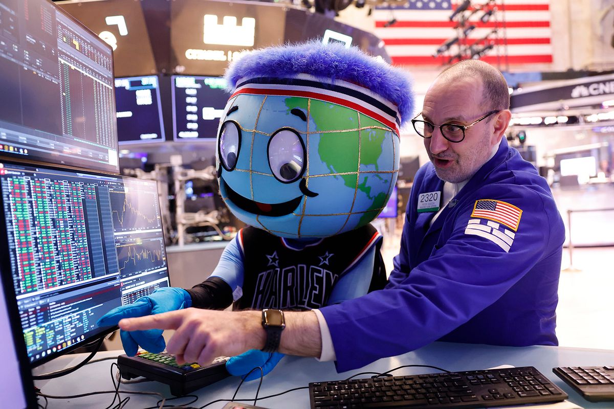 NEW YORK, NEW YORK - FEBRUARY 23: Harlem Globetrotter mascot Globey watches as trader Pete Giacchi works on the floor of the New York Stock Exchange during morning trading on February 23, 2024 in New York City. The market opened continuing its rise after yesterdays closing with the S&P 500, the Nasdaq Composite posting their best day since early 2023 and the Dow Jones surpassing 39,000 for the first time ever amid Nvidia reporting a stronger-than-expected quarterly results. (Photo by Michael M. Santiago/Getty Images)