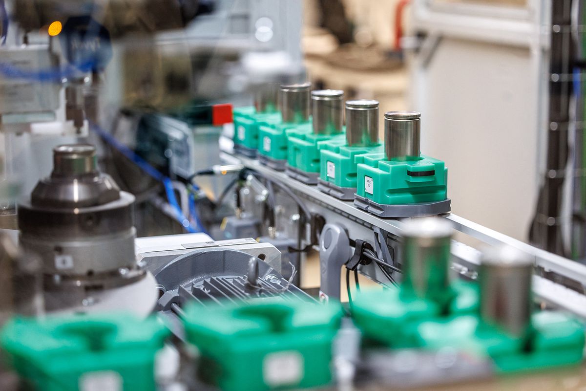 BMW Battery Cell Competence Center
26 October 2023, Bavaria, Vaterstetten: BMW round cells are seen during a press tour of BMW's Cell Manufacturing Competence Centre (CMCC) in Parsdorf, Germany, in a machine that seals the cells, in a factory hall in the "Battery Assembly" area. Photo: Matthias Balk/dpa (Photo by MATTHIAS BALK / DPA / dpa Picture-Alliance via AFP)