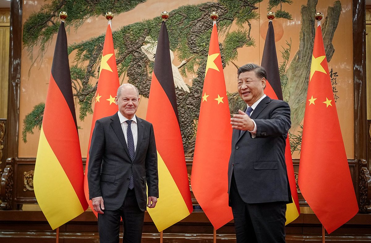 Chinese President Xi Jinping (R) welcomes German Chancellor Olaf Scholz at the Great Hall of the People in Beijing on November 4, 2022. (Photo by Kay Nietfeld / POOL / AFP)