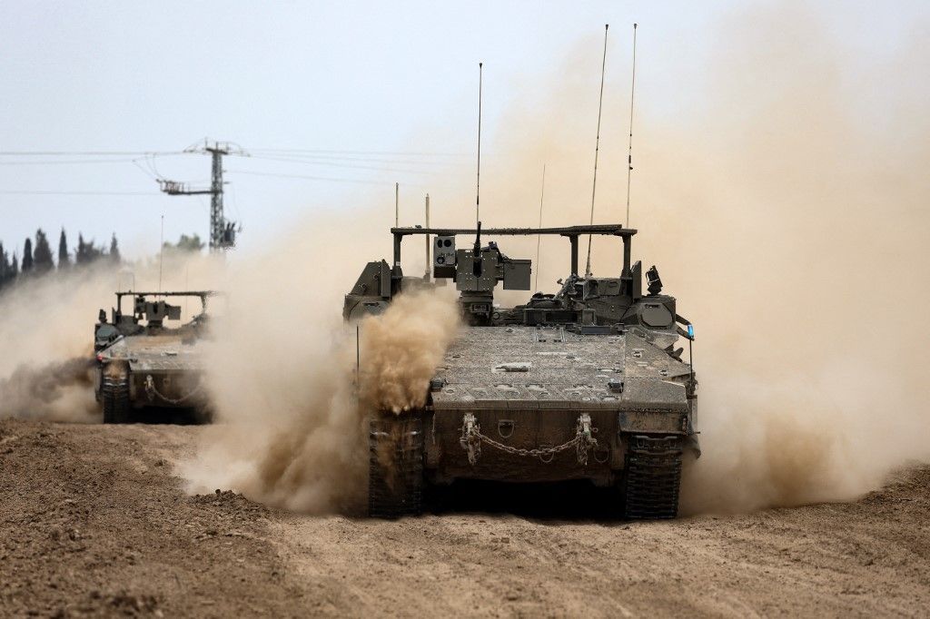 Israel tanks roll along the border with the Gaza Strip on February 23, 2024, amid ongoing battles between Israel and the Palestinian militant group Hamas. (Photo by JACK GUEZ / AFP)