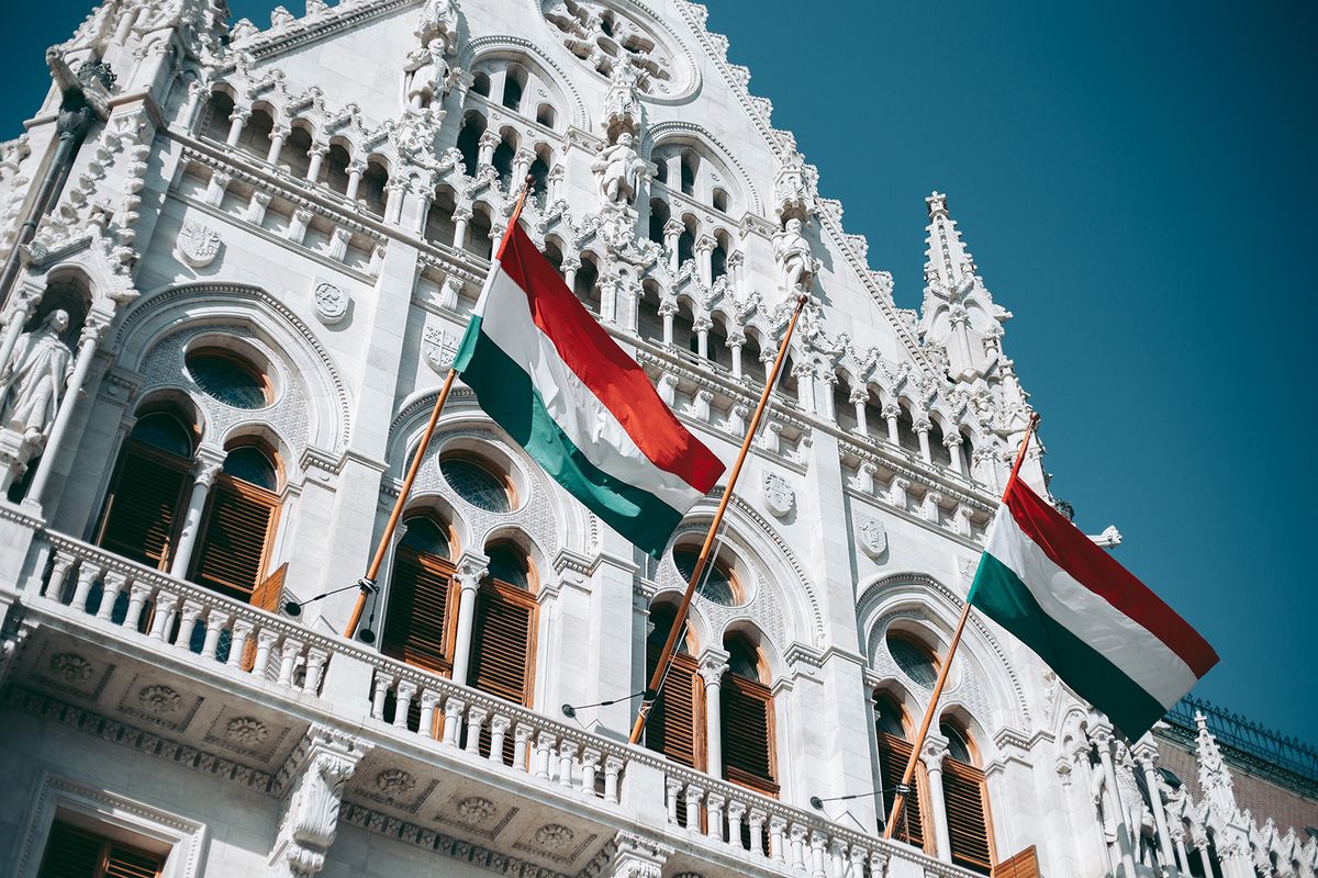 Hungary,Flag,On,The,Facade,Of,The,Budapest,Parliament,Building