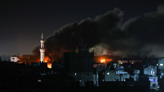 Smoke billows during Israeli bombardment over Rafah in the southern Gaza Strip on February 12, 2024 amid the ongoing conflict between Israel and the Palestinian Hamas militant group. A series of Israeli air strikes on the southern Gaza town of Rafah on February 12, 2024 killed 52 people, according to the Hamas-ruled territory's health ministry. The strikes hit 14 houses and three mosques in different parts of Rafah, according to the Hamas government.
