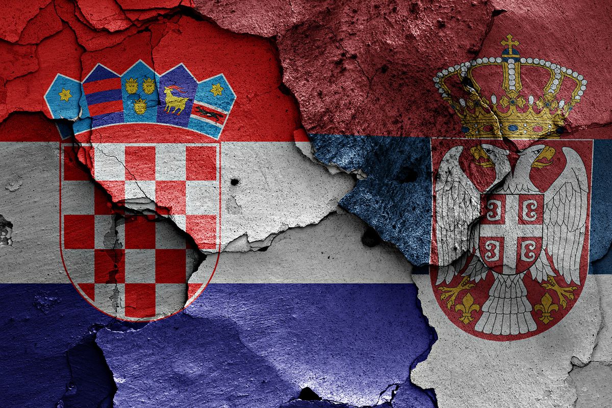 Flags,Of,Croatia,And,Serbia,Painted,On,Cracked,Wall