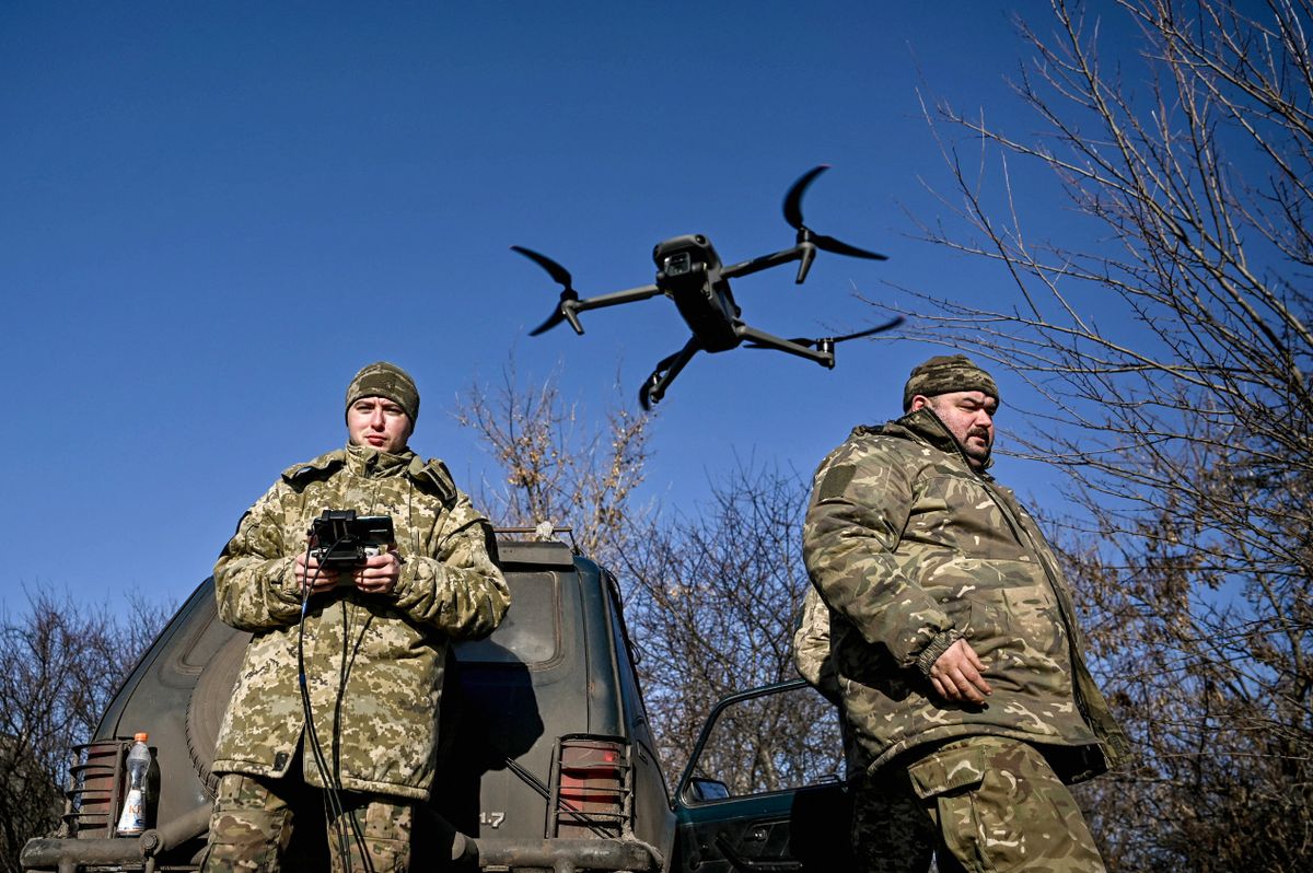 Servicemen from an artillery unit of the 128th Mountain Assault Brigade of the Ukrainian Ground Forces are training to use a drone during a training session in Ukraine, on December 28, 2023. (Photo by Ukrinform/NurPhoto) (Photo by Dmytro Smolienko / NurPhoto / NurPhoto via AFP)