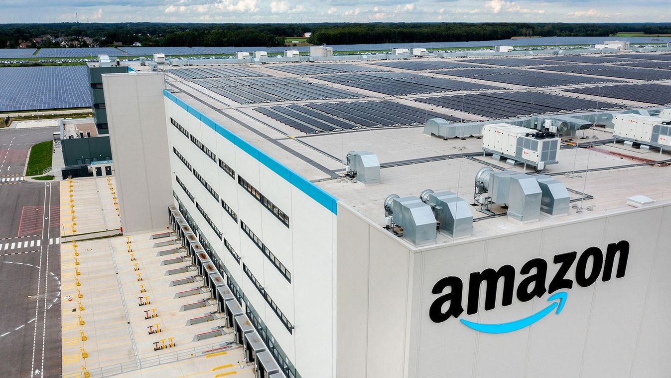 28 August 2023, Lower Saxony, Großenkneten: The Amazon logo hangs on the company's new logistics center at the former Ahlhorn air base. (Aerial view with a drone) By the end of the year, around 1,000 jobs are to be created at the online retailer's new site. Photo: Hauke-Christian Dittrich/dpa (Photo by Hauke-Christian Dittrich / DPA / dpa Picture-Alliance via AFP)