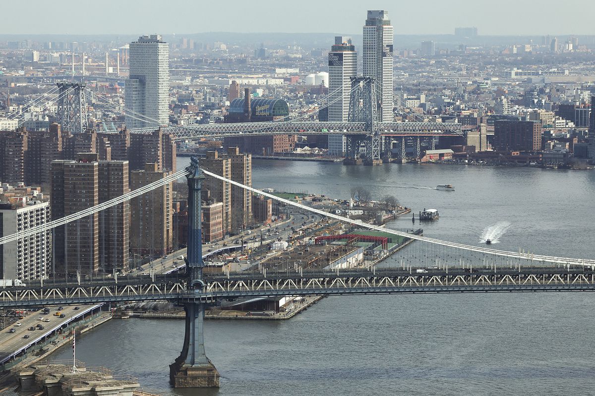 From top to bottom, the Williamsburg Bridge  and the Manhattan Bridge span the East River in New York City on February 12, 2024. (Photo by Charly TRIBALLEAU / AFP)
