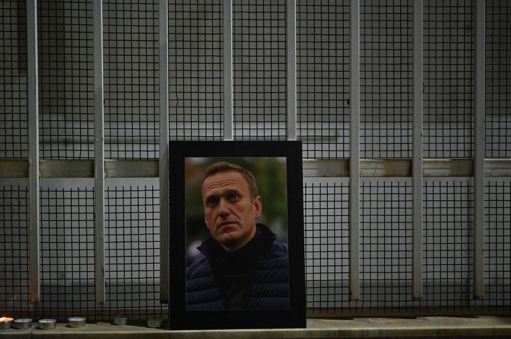 A portrait of late Russian opposition leader Alexei Navalny, who died in a Russian Arctic prison, is pictured at the entrance of the Chancery of the Embassy of the Russian Federation in Pristina on February 20, 2024. (Photo by Armend NIMANI / AFP)