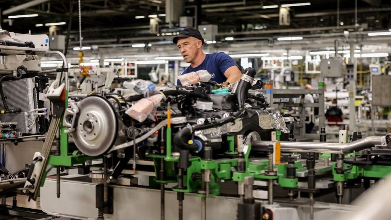 An employee is at work on the production line of the new Peugeot e-3008 electric car on September 12, 2023 at the Stellantis factory in Sochaux, France. (Photo by ARNAUD FINISTRE / AFP)