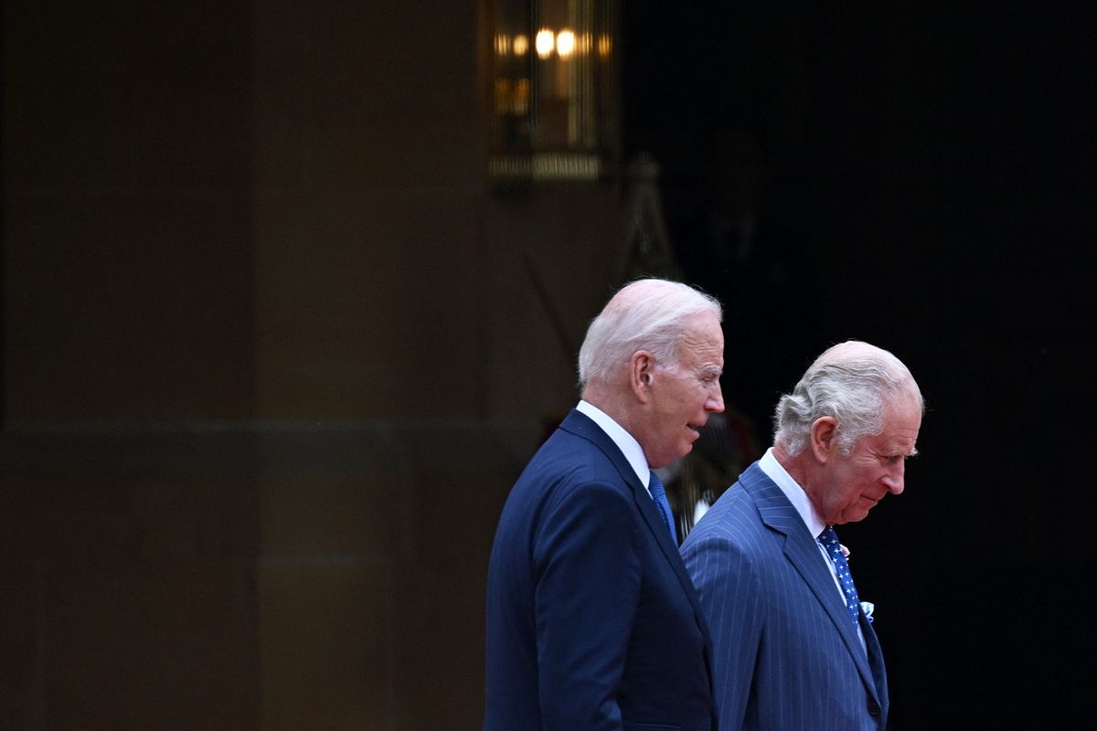 US President Joe Biden (L) and Britain's King Charles III (R) inspect the Guard of Honour formed by the Welsh Guards, during a ceremonial welcome in the Quadrangle at Windsor Castle in Windsor on July 10, 2023. US President Joe Biden was in Britain on Monday, where he met with Prime Minister Rishi Sunak and King Charles III, before going on to a NATO summit in Lithuania. (Photo by ANDREW CABALLERO-REYNOLDS / AFP)