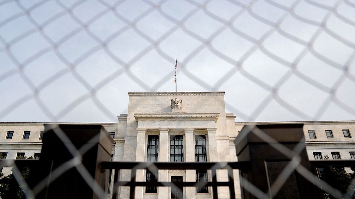 The Marriner S. Eccles Federal Reserve building is seen through fencing in Washington, DC, on April 13, 2022. (Photo by Stefani Reynolds / AFP)