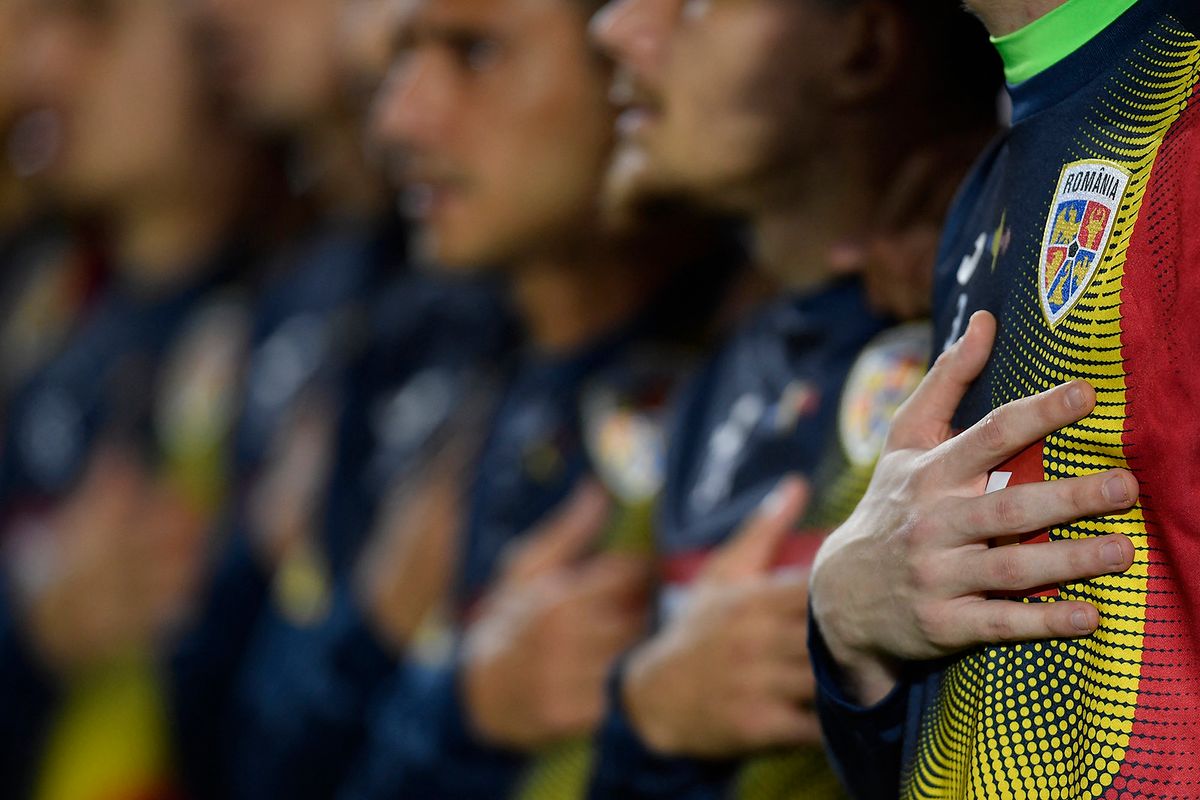 A romanian player touches his heart during the anthem  in action during the UEFA Nations League -League B Group 3 match between Romania and Montenegro at Rapid Giulesti Stadium on June 14, 2022 in Bucharest, Romania. (Photo by Alex Nicodim/NurPhoto) (Photo by Alex Nicodim / NurPhoto / NurPhoto via AFP)