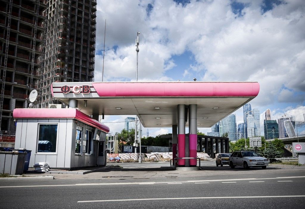 This photograph taken on July 29, 2022 in Moscow, Russia, shows a petrol station. A vintage pump in the Vietnamese hills; a Madrid petrol station topped with a giant sombrero; a multi-coloured futuristic fuel outlet in Dubai – whatever its form the humble filling stop, emblem of our modern societies, would appear to be running out of road. (Photo by Alexander NEMENOV / AFP)