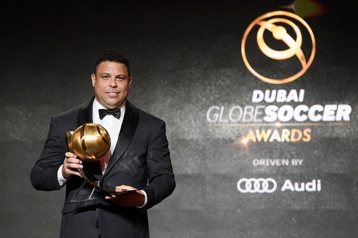 Brazilian retired footballer, Ronaldo Luis Nazario de Lima aka Ronaldo, poses after receiving a "Player Career Award" during the 10th edition of the Dubai Globe Soccer Awards on January 3, 2019 in Dubai. (Photo by Fabio FERRARI / La Presse / AFP) / Italy OUT - China OUT