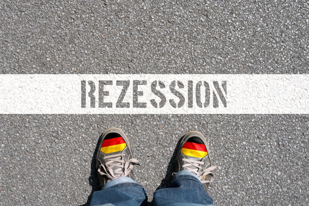 Man,,Shoes,With,German,Flag,And,German,Translation,For,Recession