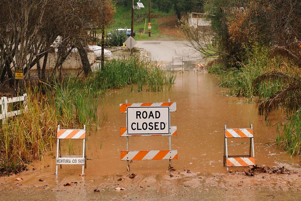 Ventura, CA - February 04: Flooding is seen along Camp Chafee Road at Casitas Vista Road on Sunday, Feb. 4, 2024 in Ventura, CA. Officials across Southern and Central California are urgently warning residents to prepare as a storm system fueled by an atmospheric river brings heavy rainfall.  (Dania Maxwell / Los Angeles Times via Getty Images)