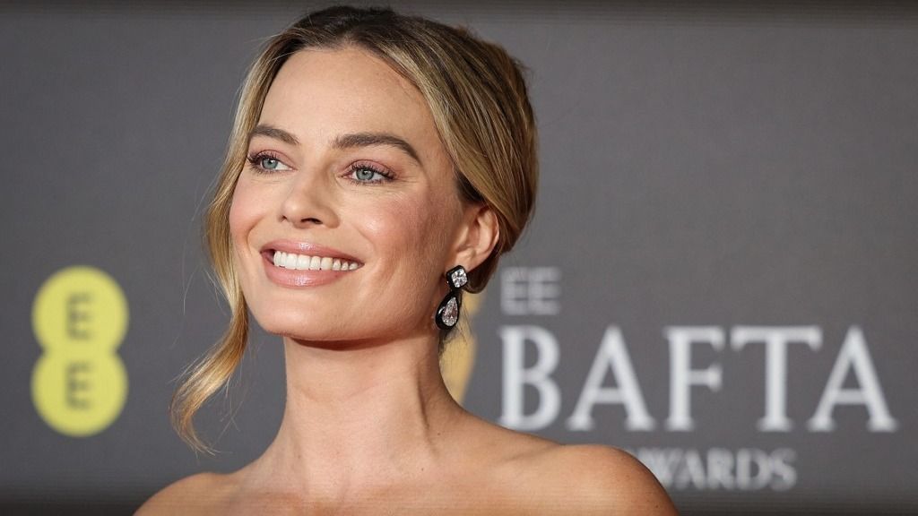 Australian actress Margot Robbie poses on the red carpet upon arrival at the BAFTA British Academy Film Awards at the Royal Festival Hall, Southbank Centre, in London, on February 18, 2024. (Photo by Adrian DENNIS / AFP)
