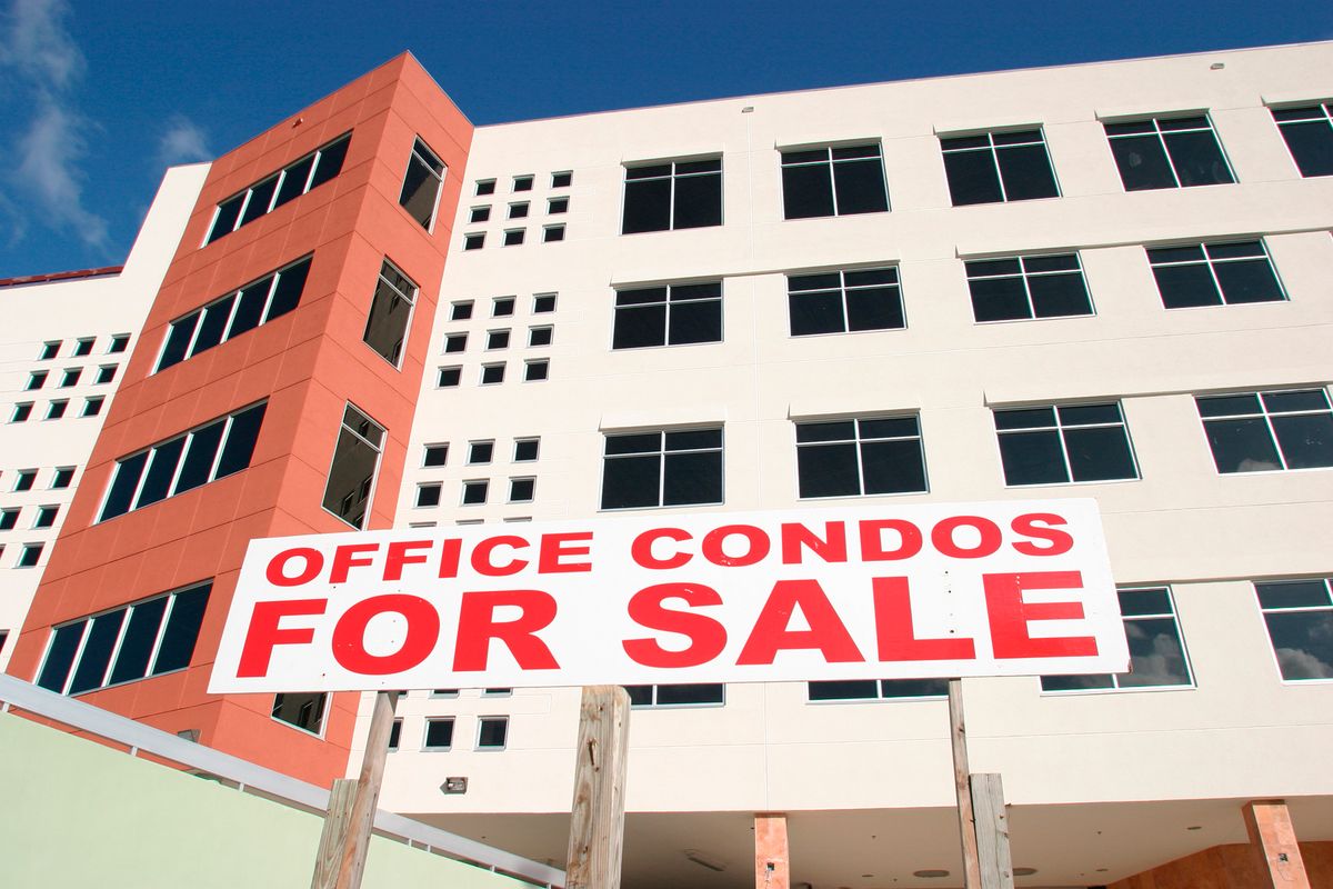Office condos for sale sign.