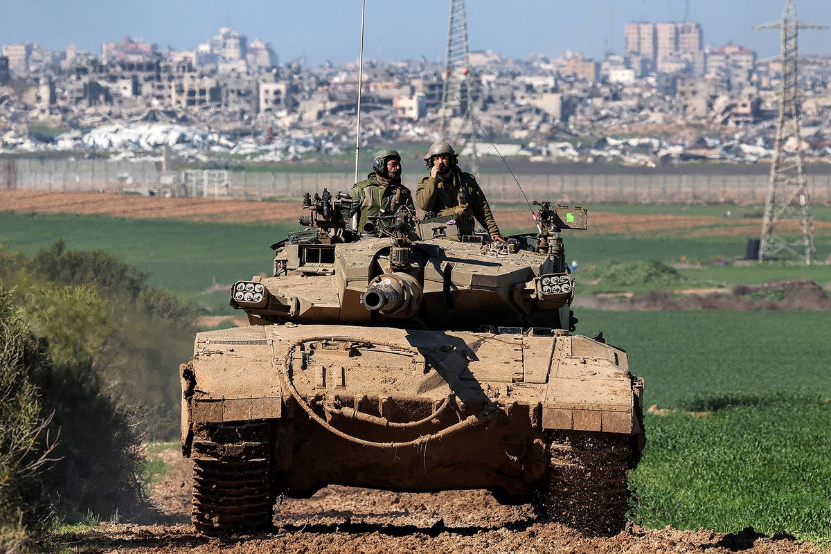 An Israeli army battle tank moves at a position along the border between southern Israeli and the Gaza Strip on January 31, 2024 amid the ongoing conflict between Israel and the Palestinian militant group Hamas. (Photo by JACK GUEZ / AFP)
