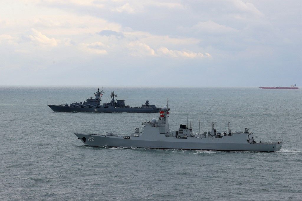 CHINA-RUSSIA-JOINT NAVAL EXERCISE-CONCLUSION (CN)(221227) -- ABOARD DESTROYER JINAN, Dec. 27, 2022 (Xinhua) -- Destroyer Jinan from Chinese navy (front) and cruiser Varyag from Russian navy sail in formation after a joint naval exercise, Joint Sea 2022, in the East China Sea on Dec. 27, 2022. Chinese and Russian navies concluded the seven-day joint naval exercise Tuesday in the East China Sea. TO GO WITH "China, Russia conclude joint naval exercise" (Photo by Sun Fei/Xinhua) (Photo by Sun Fei / XINHUA / Xinhua via AFP)