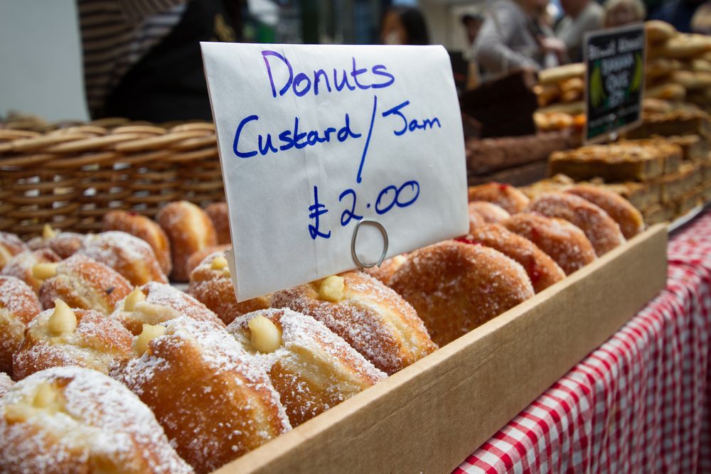Doughnuts,With,Custard,And,Jam,For,Sale,At,Food,Market.