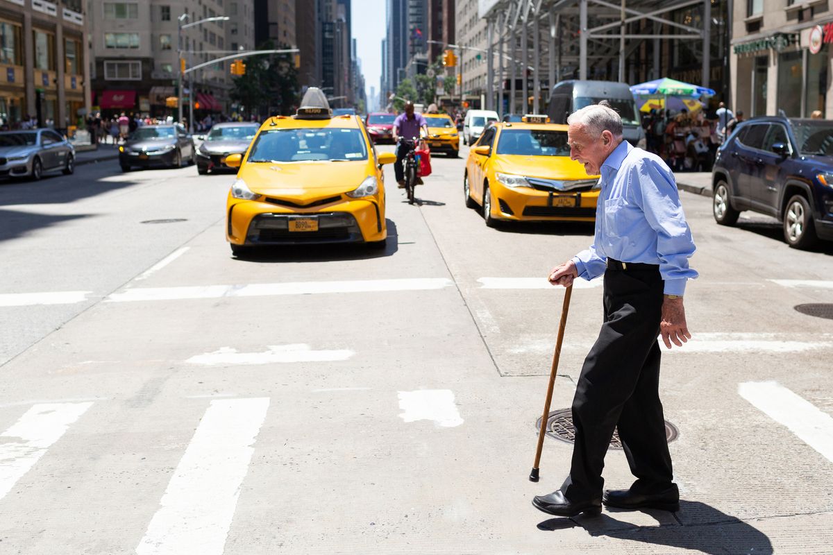 Senior man crossing the road in New York City